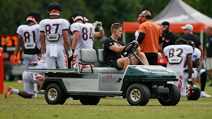 Cincinnati Bengals quarterback Joe Burrow (9) watches from a cart during a preseason training camp