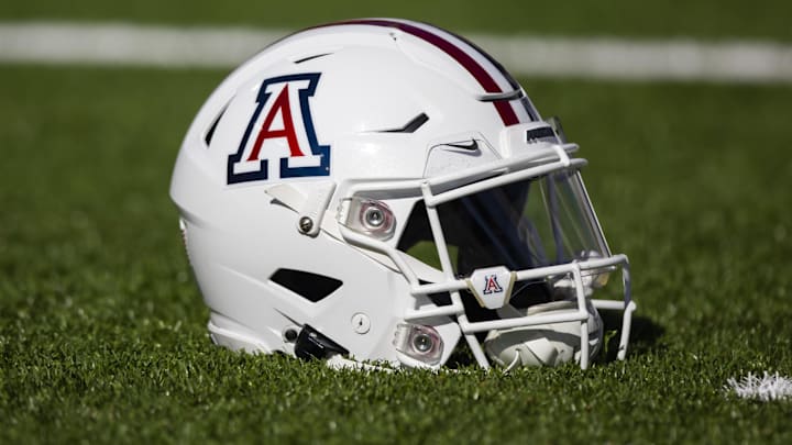 Nov 25, 2022; Tucson, Arizona, USA; Detailed view of an Arizona Wildcats helmet on the field during the Territorial Cup at Arizona Stadium. Mandatory Credit: Mark J. Rebilas-Imagn Images Nov 25, 2022; Tucson, Arizona, USA; Detailed view of an Arizona Wildcats helmet on the field during the Territorial Cup at Arizona Stadium. Mandatory Credit: Mark J. Rebilas-Imagn Images