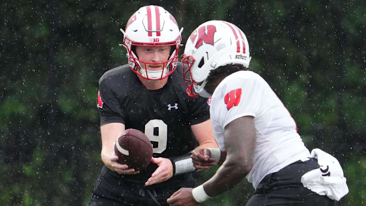 Wisconsin quarterback Billy Edwards Jr. (9) gives a handoff to running back Darrion Dupree (6) during football practice Wednesday, July 30, 2025, at Ralph E. Davis Pioneer Stadium in Platteville, Wisconsin.