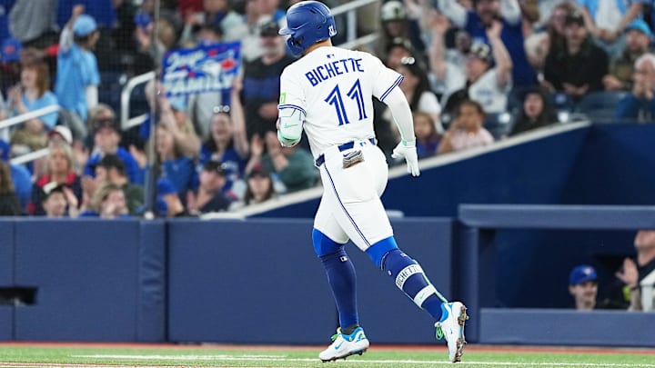 May 3, 2025; Toronto, Ontario, CAN; Toronto Blue Jays shortstop Bo Bichette (11) runs the bases after hitting a home run during the first inning at Rogers Centre. 
