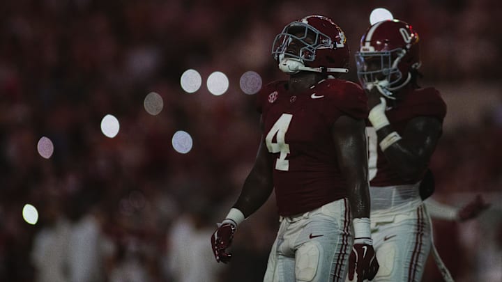 Aug 31, 2024; Tuscaloosa, Alabama, USA; Alabama Crimson Tide linebacker Qua Russaw (4) walks onto the field with Alabama’s defense during the second quarter at Bryant-Denny Stadium. Mandatory Credit: Will McLelland-Imagn Images
