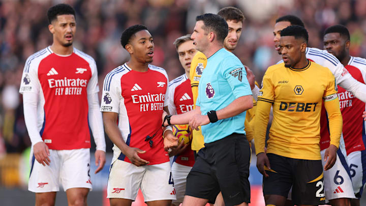 Myles Lewis-Skelly (left, centre) was sent off by referee Michael Oliver on Saturday