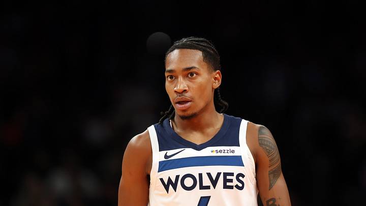 Nov 21, 2025; Phoenix, Arizona, USA; Minnesota Timberwolves guard Rob Dillingham (4) against the Phoenix Suns during an NBA Cup game at Mortgage Matchup Center. Mandatory Credit: Mark J. Rebilas-Imagn Images