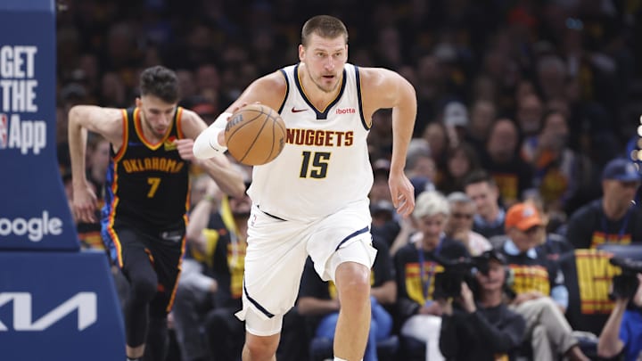 May 5, 2025; Oklahoma City, Oklahoma, USA; Denver Nuggets center Nikola Jokic (15) dribbles against the Oklahoma City Thunder during the second quarter during game one of the second round for the 2025 NBA Playoffs at Paycom Center. Mandatory Credit: Alonzo Adams-Imagn Images