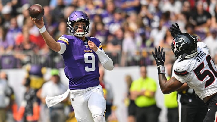 Vikings quarterback J.J. McCarthy throws on the run against Houston in preseason.