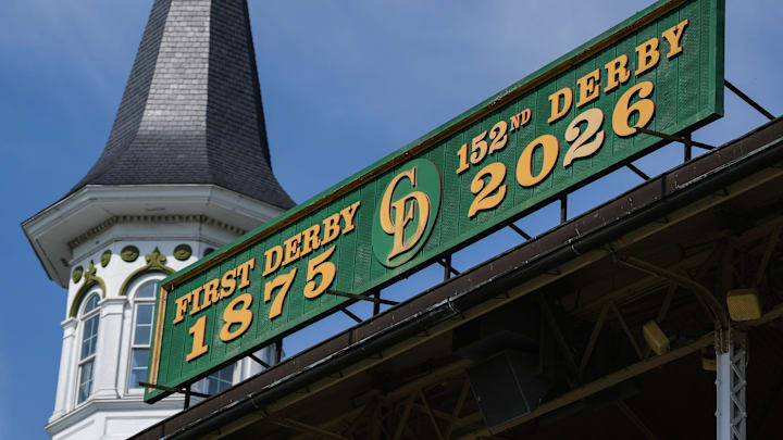 Churchill Downs employees Corey McGreal and Todd Herl work to update the iconic green Kentucky Derby sign above the Grandstand to reflect the 152nd Running of the Kentucky Derby. April 1, 2026.
