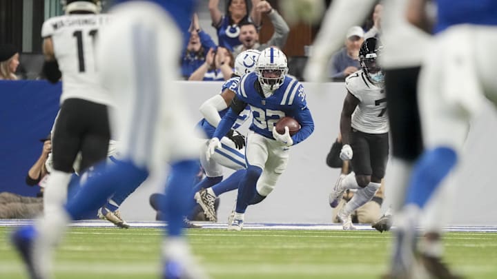 Jan 5, 2025; Indianapolis, Indiana, USA; Indianapolis Colts safety Julian Blackmon (32) turns to run after intercepting a pass during a game against the Jacksonville Jaguars at Lucas Oil Stadium. Mandatory Credit: Grace Hollars/USA TODAY Network via Imagn Images