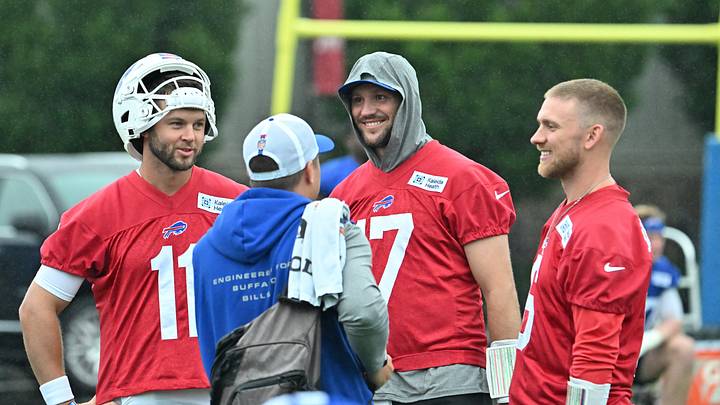 Buffalo Bills Josh Allen (17) talks with fellow quarterbacks Kyle Allen (11) and Shane Buechele (6) during training camp at St. John Fisher University. Buffalo Bills Josh Allen (17) talks with fellow quarterbacks Kyle Allen (11) and Shane Buechele (6) during training camp at St. John Fisher University.