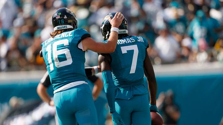 Oct 27, 2024; Jacksonville, Florida, USA; Jacksonville Jaguars quarterback Trevor Lawrence (16) and wide receiver Brian Thomas Jr. (7) celebrate a touchdown against the Green Bay Packers during the third quarter at EverBank Stadium. Mandatory Credit: Morgan Tencza-Imagn Images Oct 27, 2024; Jacksonville, Florida, USA; Jacksonville Jaguars quarterback Trevor Lawrence (16) and wide receiver Brian Thomas Jr. (7) celebrate a touchdown against the Green Bay Packers during the third quarter at EverBank Stadium. Mandatory Credit: Morgan Tencza-Imagn Images