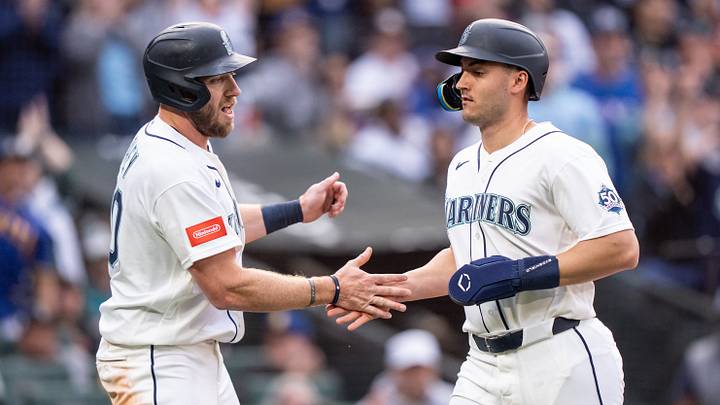 Apr 18, 2026; Seattle, Washington, USA; Seattle Mariners right fielder Luke Raley (20), left, and designated hitter Dominic Canzone (8) celebrate after scoring runs during the eighth inning against the Texas Rangers at T-Mobile Park. Mandatory Credit: Stephen Brashear-Imagn Images Apr 18, 2026; Seattle, Washington, USA; Seattle Mariners right fielder Luke Raley (20), left, and designated hitter Dominic Canzone (8) celebrate after scoring runs during the eighth inning against the Texas Rangers at T-Mobile Park. Mandatory Credit: Stephen Brashear-Imagn Images