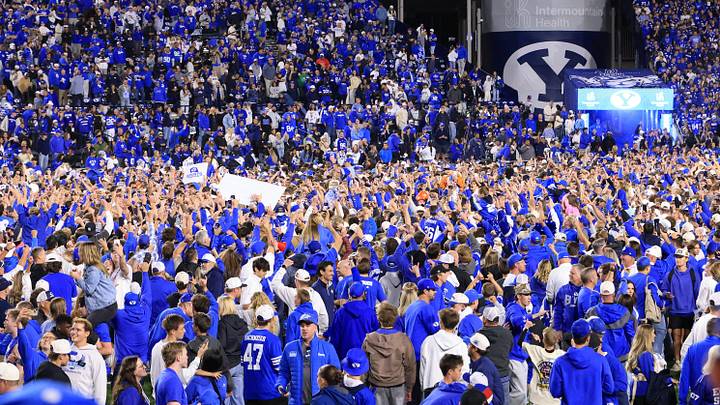 Oct 17, 2026; Provo, Utah, USA; Brigham Young Cougars fans celebrate after the game against the Notre Dame Fighting Irish at LaVell Edwards Stadium. Mandatory Credit: Rob Gray-Imagn Images Oct 17, 2026; Provo, Utah, USA; Brigham Young Cougars fans celebrate after the game against the Notre Dame Fighting Irish at LaVell Edwards Stadium. Mandatory Credit: Rob Gray-Imagn Images