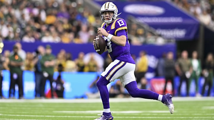 Dec 31, 2024; Houston, TX, USA; LSU Tigers quarterback Garrett Nussmeier (13) runs the ball during the first half against the Baylor Bears at NRG Stadium. Mandatory Credit: Maria Lysaker-Imagn Images 