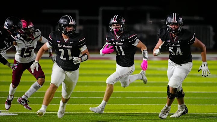 Red Mountain wide receiver Bode Wagner (11) runs downfield against Downey (CA) during the Honor Bowl game at Red Mountain High School on Sept. 20, 2024.