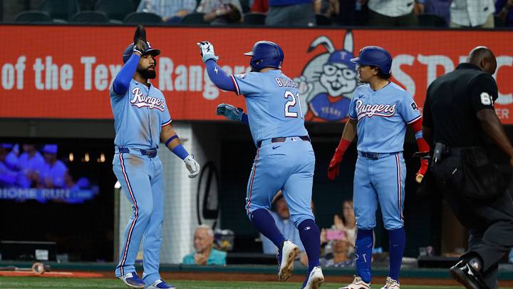 Sep 20, 2026; Arlington, Texas, USA; Texas Rangers first baseman Jake Burger (21) celebrates with teammates after hitting a two-run home run during the fourth inning against the Toronto Blue Jays at Globe Life Field. Mandatory Credit: Chris Jones-Imagn Images Sep 20, 2026; Arlington, Texas, USA; Texas Rangers first baseman Jake Burger (21) celebrates with teammates after hitting a two-run home run during the fourth inning against the Toronto Blue Jays at Globe Life Field. Mandatory Credit: Chris Jones-Imagn Images