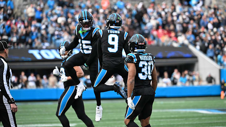 Dec 21, 2025; Charlotte, North Carolina, USA; Carolina Panthers quarterback Bryce Young (9) reacts with wide receiver Jimmy Horn Jr. (15) as running back Chuba Hubbard (30) is in the foreground in the third quarter at Bank of America Stadium. Mandatory Credit: Bob Donnan-Imagn Images