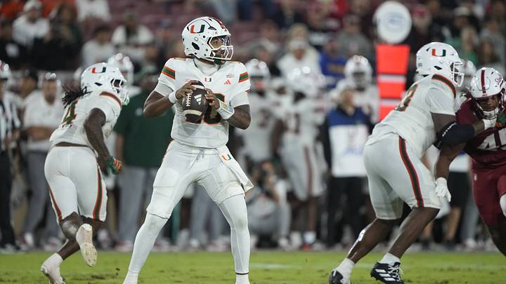 Sep 4, 2026; Stanford, California, USA;  aMiami Hurricanes quarterback Darian Mensah (10) stands in the pocket against the Stanford Cardinal during the third quarter at Stanford Stadium.  Mandatory Credit: Stan Szeto-Imagn Images