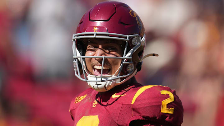 Sep 28, 2024; Los Angeles, California, USA; Southern California Trojans wide receiver Duce Robinson (2) celebrates after scoring on an 8-yard touchdown reception against the Wisconsin Badgersin the second half at United Airlines Field at Los Angeles Memorial Coliseum. Mandatory Credit: Kirby Lee-Imagn Images