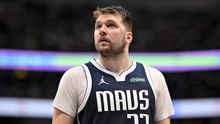 Dec 23, 2024; Dallas, Texas, USA; Dallas Mavericks guard Luka Doncic (77) checks the scoreboard during the second half against the Portland Trail Blazers at the American Airlines Center. 