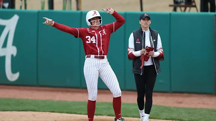 Alabama Softball Player Marlie Giles (34) celebrates at first against Virginia Tech at Rhoads Stadium in Tuscaloosa, AL on Sunday, Feb 23, 2025.