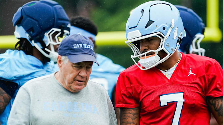 North Carolina Head Coach talking with Gio Lopez