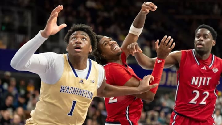 Great Osobor mixes it up with a pair of NJIT players on Sunday. 