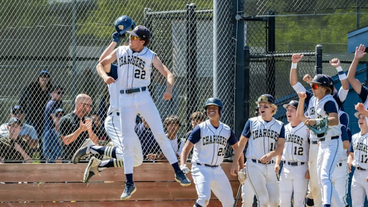 The Dos Pueblos baseball team celebrates during a game against Trinity Classical Academy.