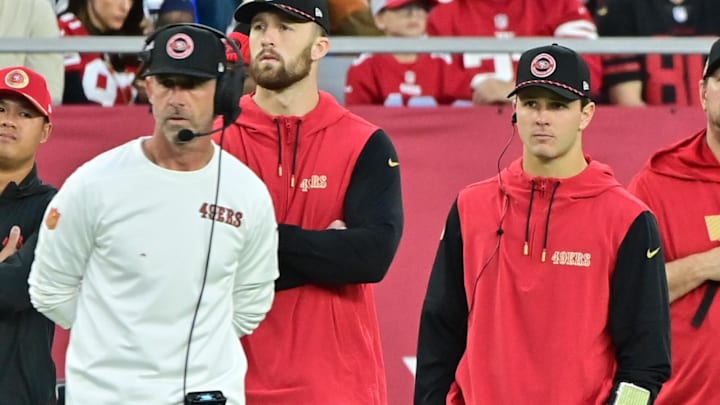 Jan 5, 2025; Glendale, Arizona, USA; San Francisco 49ers quarterback Brock Purdy (right) and head coach Kyle Shanahan (left) look on the in second half against the Arizona Cardinals at State Farm Stadium. Mandatory Credit: Matt Kartozian-Imagn Images Jan 5, 2025; Glendale, Arizona, USA; San Francisco 49ers quarterback Brock Purdy (right) and head coach Kyle Shanahan (left) look on the in second half against the Arizona Cardinals at State Farm Stadium. Mandatory Credit: Matt Kartozian-Imagn Images