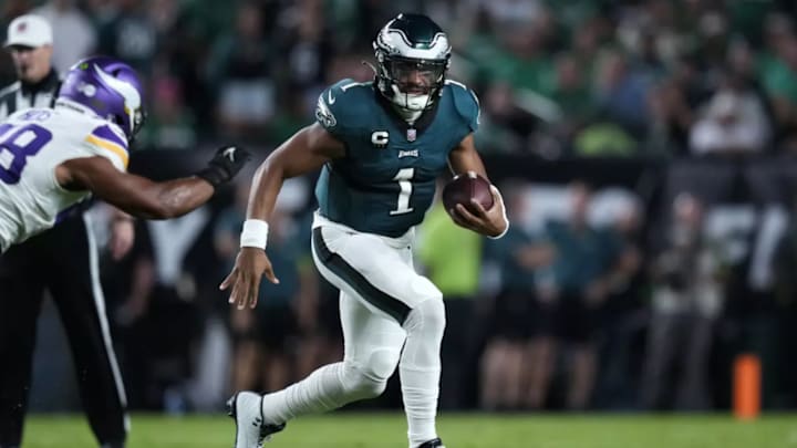 Jalen Hurts escaping from a Vikings defender. Jalen Hurts escaping from a Vikings defender.