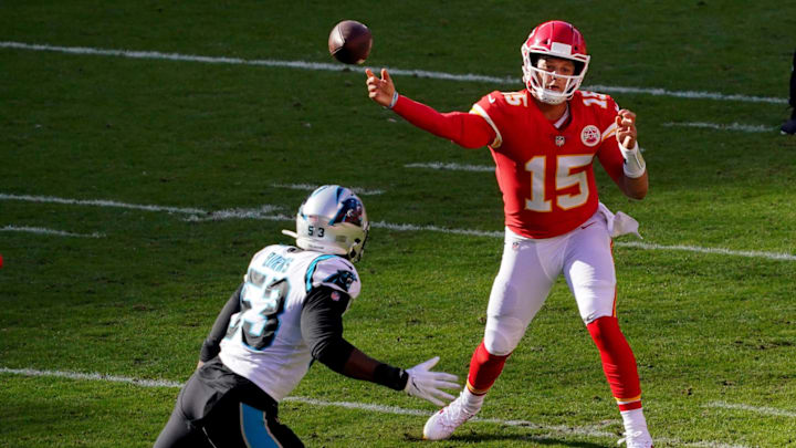 Nov 8, 2020; Kansas City, Missouri, USA; Kansas City Chiefs quarterback Patrick Mahomes (15) throws a pass against Carolina Panthers defensive end Brian Burns (53) \ during the second half at Arrowhead Stadium.