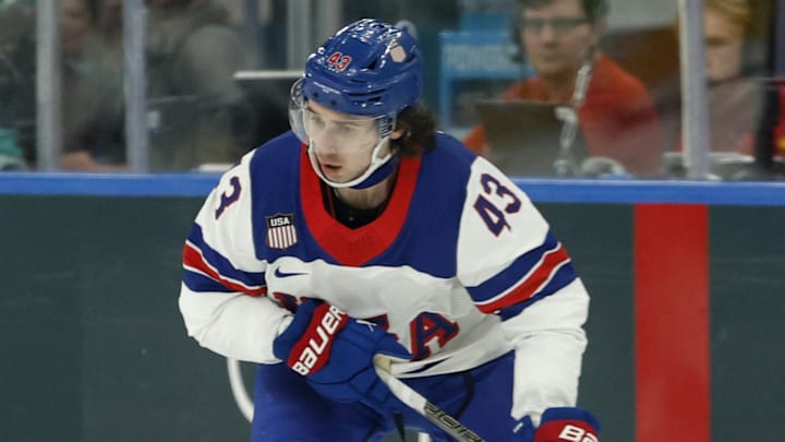 Feb 12, 2026; Milan, Italy; Quinn Hughes of United States in action against Latvia in men's ice hockey group C play during the Milano Cortina 2026 Olympic Winter Games at Milano Santagiulia Ice Hockey Arena. Mandatory Credit: Geoff Burke-Imagn Images Feb 12, 2026; Milan, Italy; Quinn Hughes of United States in action against Latvia in men's ice hockey group C play during the Milano Cortina 2026 Olympic Winter Games at Milano Santagiulia Ice Hockey Arena. Mandatory Credit: Geoff Burke-Imagn Images
