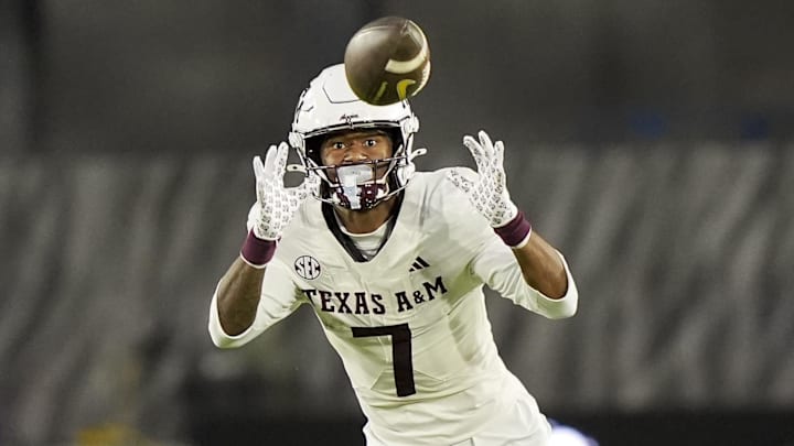 Texas A&M Aggies wide receiver KC Concepcion (7) returns a punt during the second half against the Missouri Tigers at Faurot Field at Memorial Stadium. Mandatory Credit: Jay Biggerstaff-Imagn Images