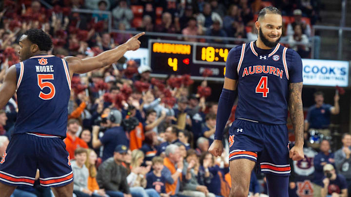 Auburn Tigers player Johni Broome (4) reacts to his dunk as Auburn Tigers take on Virginia Tech
