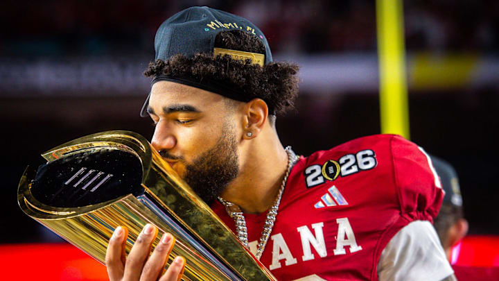 Indiana's Elijah Sarratt (13) kisses the trophy after the College Football Playoff National Championship at Hard Rock Stadium in Miami Gardens on Monday, Jan. 19, 2026.