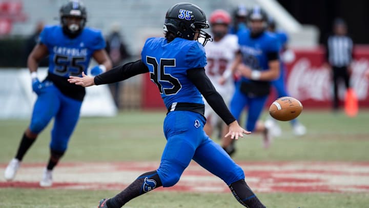 Catholic punter Gabe Russo (35) punts the ball after recovering a high snap during the Class 3A State Championship game at Bryant-Denny Stadium in Tuscaloosa, Ala., on Thursday, Dec. 3, 2020.Fyffe defeated Montgomery Catholic 21-16.