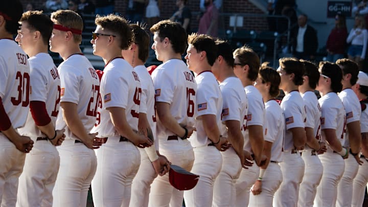 Alabama baseball lines up for the national anthem ahead of the season-opener against Washington State