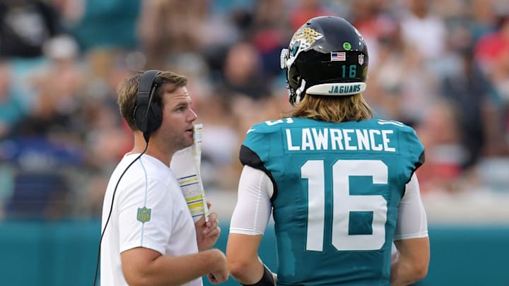 Jaguars offensive coordinator Press Taylor was on the field during the first quarter talking with Jacksonville Jaguars quarterback Trevor Lawrence (16). The Jaguars led 20 to 10 at the end of the first half. The Jacksonville Jaguars hosted the Kansas City Chiefs in the Jaguars first preseason game of the season Saturday, August10, 2024 at EverBank Stadium in Jacksonville, Fla.