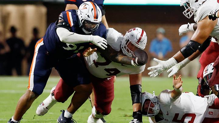 Sep 20, 2025; Charlottesville, Virginia, USA; Virginia Cavaliers defensive tackle Jason Hammond (91) and Stanford Cardinal offensive lineman Fisher Anderson (74) attempt to recover a fumble by Cardinal quarterback Ben Gulbranson (15) during the fourth quarter at Scott Stadium. Mandatory Credit: Geoff Burke-Imagn Images Sep 20, 2025; Charlottesville, Virginia, USA; Virginia Cavaliers defensive tackle Jason Hammond (91) and Stanford Cardinal offensive lineman Fisher Anderson (74) attempt to recover a fumble by Cardinal quarterback Ben Gulbranson (15) during the fourth quarter at Scott Stadium. Mandatory Credit: Geoff Burke-Imagn Images