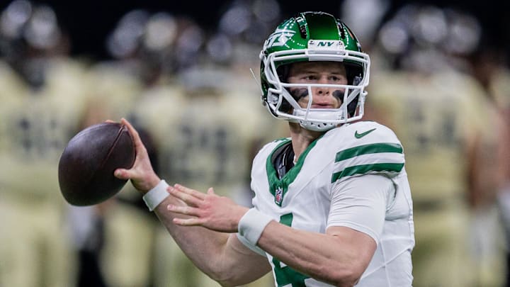 Jets quarterback Brady Cook attempts a throw.