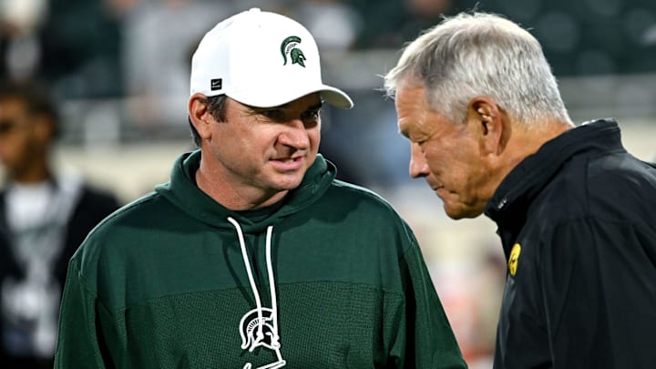 Michigan State's head coach Jonathan Smith, left, talks with Iowa head coach Kirk Ferentz before MSU's game against the Hawkeyes on Saturday, Oct. 19, 2024, at Spartan Stadium in East Lansing.