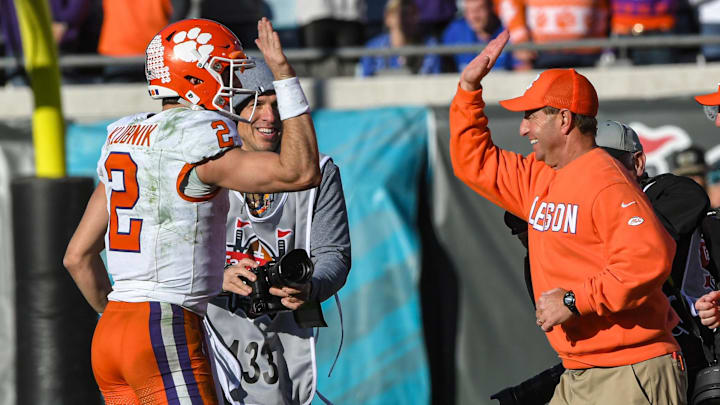 Clemson quarterback Cade Klubnik (2) gives a high five to Head Coach Dabo Swinney after the TaxSlayer Gator Bowl at EverBank Stadium in Jacksonville, Florida, Friday, December 29, 2023. Clemson beat Kentucky 38-35.