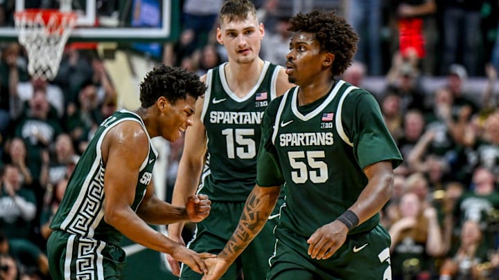Michigan State's Jeremy Fears Jr., left, slaps hands with Coen Carr, right, after Carr's dunk against Northwestern during the second half on Thursday, Jan. 8, 2026, at the Breslin Center in East Lansing.