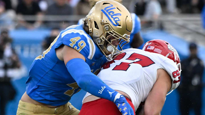 Nov 30, 2024; Pasadena, California, USA; UCLA Bruins linebacker Carson Schwesinger (49) Fresno State Bulldogs tight end Jake Tarwater (87) during the third quarter at Rose Bowl. Mandatory Credit: Robert Hanashiro-Imagn Images Nov 30, 2024; Pasadena, California, USA; UCLA Bruins linebacker Carson Schwesinger (49) Fresno State Bulldogs tight end Jake Tarwater (87) during the third quarter at Rose Bowl. Mandatory Credit: Robert Hanashiro-Imagn Images