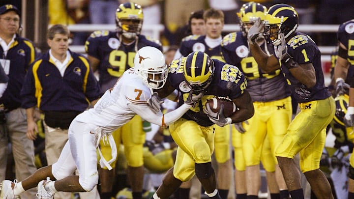 Jan 1, 2005; Pasadena, CA, USA: FILE PHOTO; Michigan Wolverines tight end Tim Massaquoi (88) in action against Texas Longhorns cornerback Michael Huff (7) during the 2005 Rose Bowl at the Rose Bowl. The Longhorns defeated the Wolverines 38-37. Mandatory Credit: Richard Mackson-USA TODAY Network Jan 1, 2005; Pasadena, CA, USA: FILE PHOTO; Michigan Wolverines tight end Tim Massaquoi (88) in action against Texas Longhorns cornerback Michael Huff (7) during the 2005 Rose Bowl at the Rose Bowl. The Longhorns defeated the Wolverines 38-37. Mandatory Credit: Richard Mackson-USA TODAY Network
