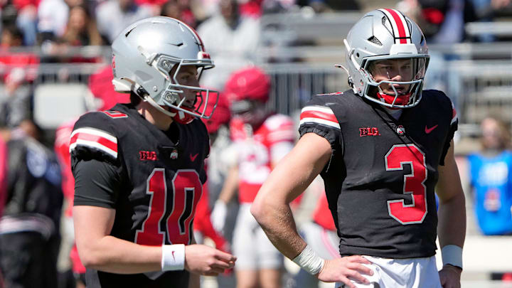 Ohio State Buckeye quarterbacks Julian Sayin (10) and Lincoln Kienholz (3) warm up before the start of the spring game at Ohio Stadium on April 12, 2025.