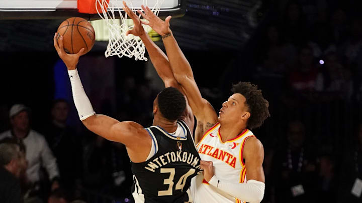 Dec 14, 2024; Las Vegas, Nevada, USA; Milwaukee Bucks forward Giannis Antetokounmpo (34) shoots against Atlanta Hawks forward Jalen Johnson (1) during the first half in a semifinal of the 2024 Emirates NBA Cup at T-Mobile Arena. Mandatory Credit: Kyle Terada-Imagn Images