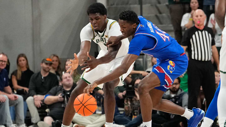 Feb 1, 2025; Waco, Texas, USA; Kansas Jayhawks forward Flory Bidunga (40)steals the ball against Baylor Bears forward Josh Ojianwuna (17) during the first half at Paul and Alejandra Foster Pavilion. Mandatory Credit: Chris Jones-Imagn Images