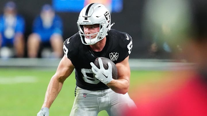 Dec 22, 2024; Paradise, Nevada, USA; Las Vegas Raiders tight end Brock Bowers (89) gains yardage after making a catch against the Jacksonville Jaguars during the fourth quarter at Allegiant Stadium. Mandatory Credit: Stephen R. Sylvanie-Imagn Images