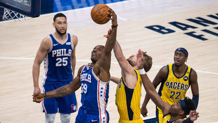 May 11, 2021; Indianapolis, Indiana, USA; Philadelphia 76ers center Dwight Howard (39) rebounds the ball over Indiana Pacers forward Domantas Sabonis (11) in the third quarter at Bankers Life Fieldhouse. Mandatory Credit: Trevor Ruszkowski-Imagn Images