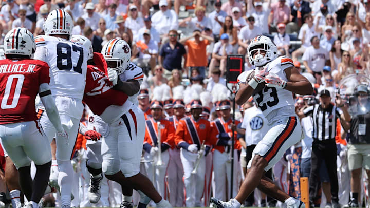 Sep 13, 2025; Auburn, Alabama, USA;  Auburn Tigers cornerback Jay Crawford (23) scores a touchdown during the second quarter against the South Alabama Jaguars at Jordan-Hare Stadium. Mandatory Credit: John Reed-Imagn Images