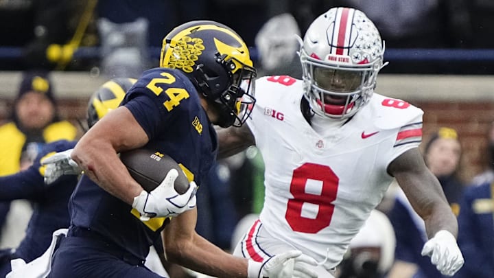 Ohio State Buckeyes linebacker Arvell Reese (8) pursues Michigan Wolverines running back Bryson Kuzdzal (24) during the NCAA football game at Michigan Stadium in Ann Arbor, Mich. on Nov. 29, 2025. Ohio State won 27-9.